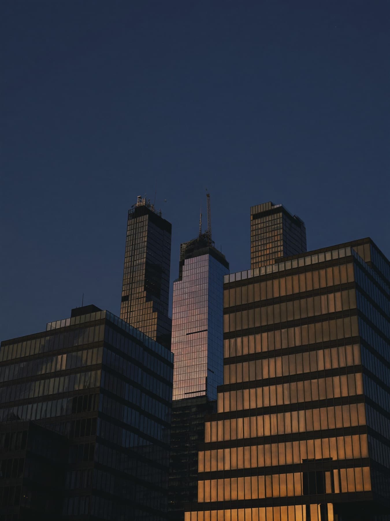 Looking up at London towers at golden hour